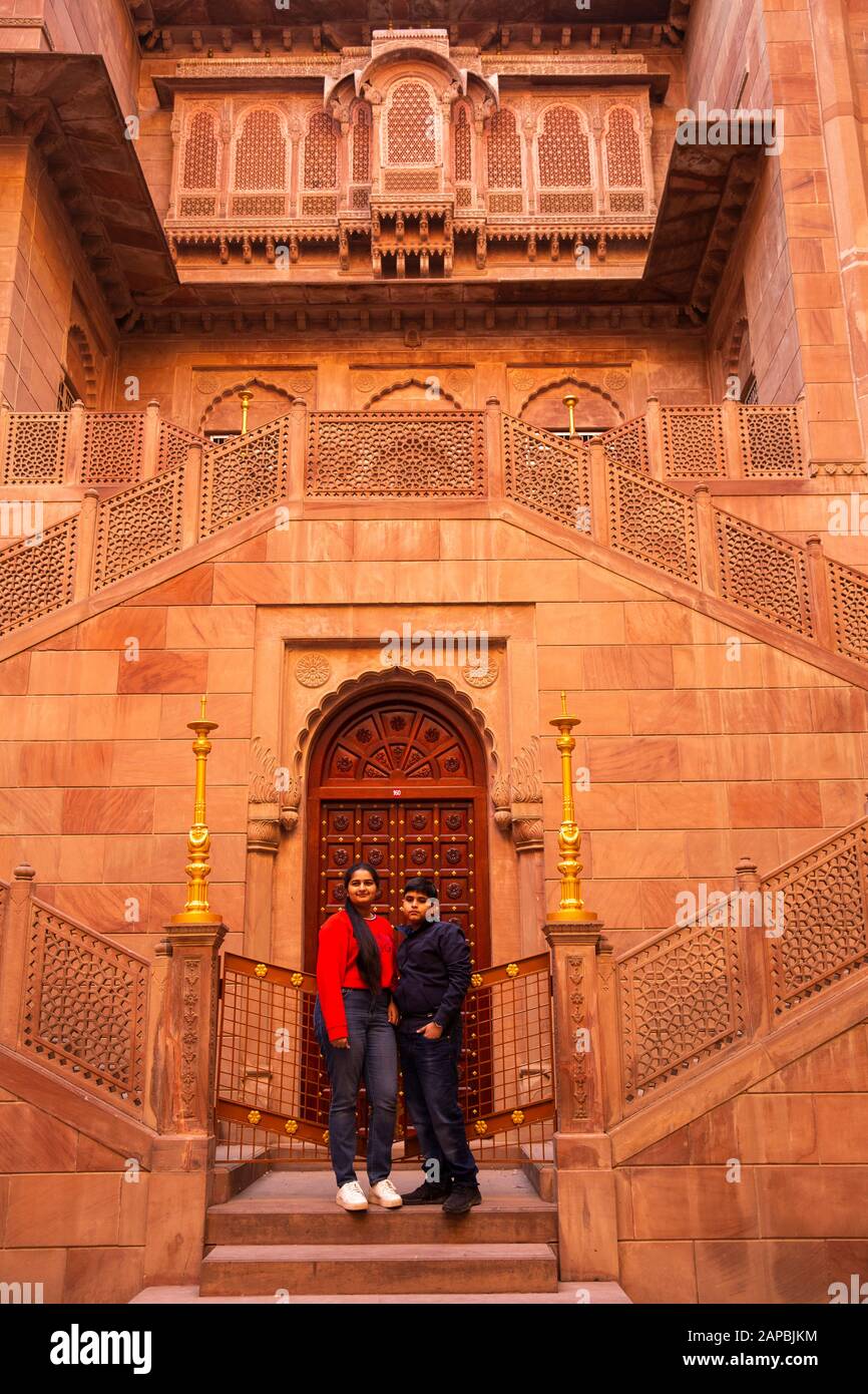 India, Rajasthan, Shekhawati, Bikaner, city centre, Junagarh Fort, Indian visitors on carved sandstone steps Stock Photo