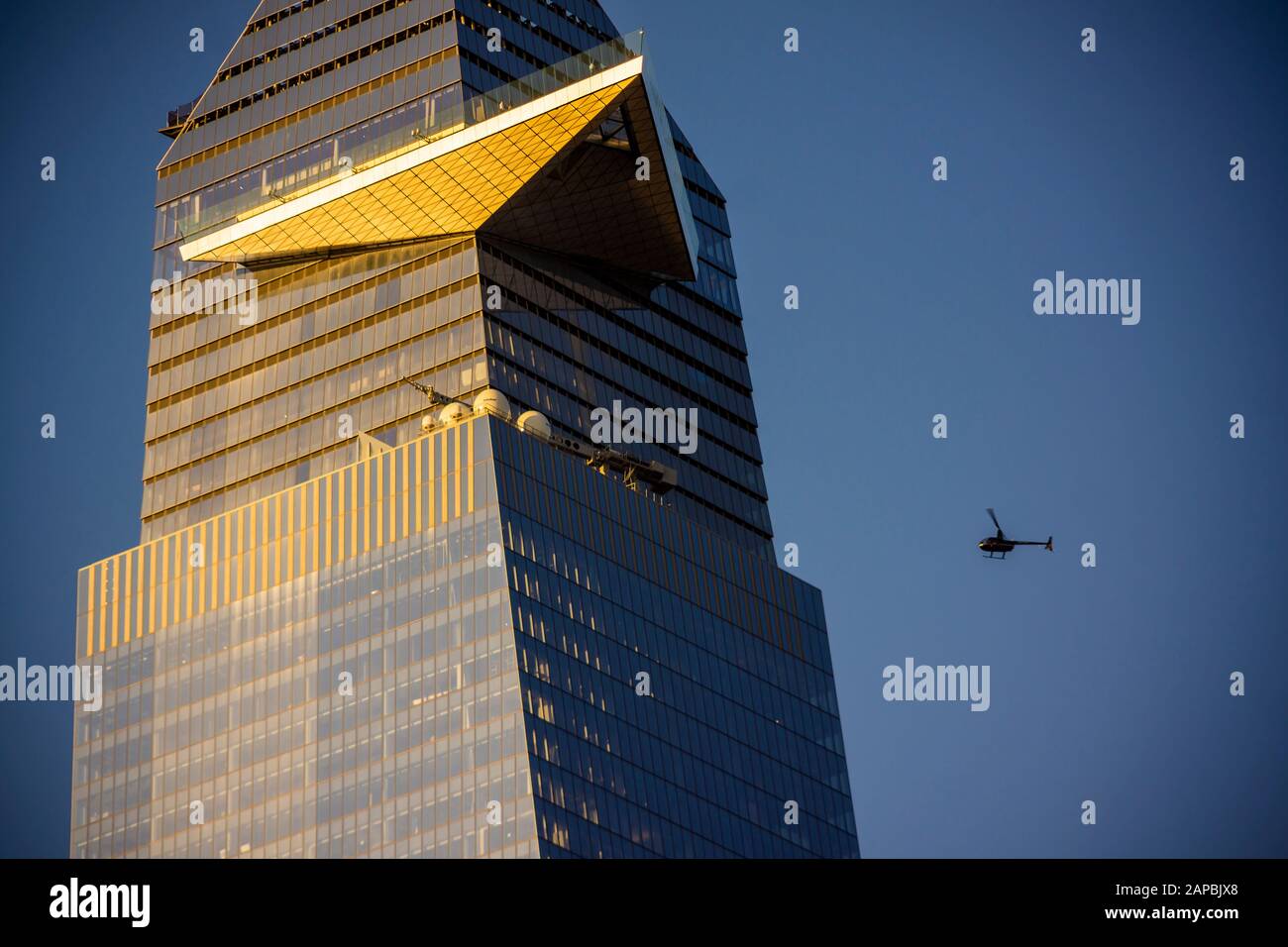 A helicopter flies past 30 Hudson Yards showing the cantilevered observation deck called 'The Edge', in New York on Wednesday, January 15, 2020 (© Richard B. Levine) Stock Photo
