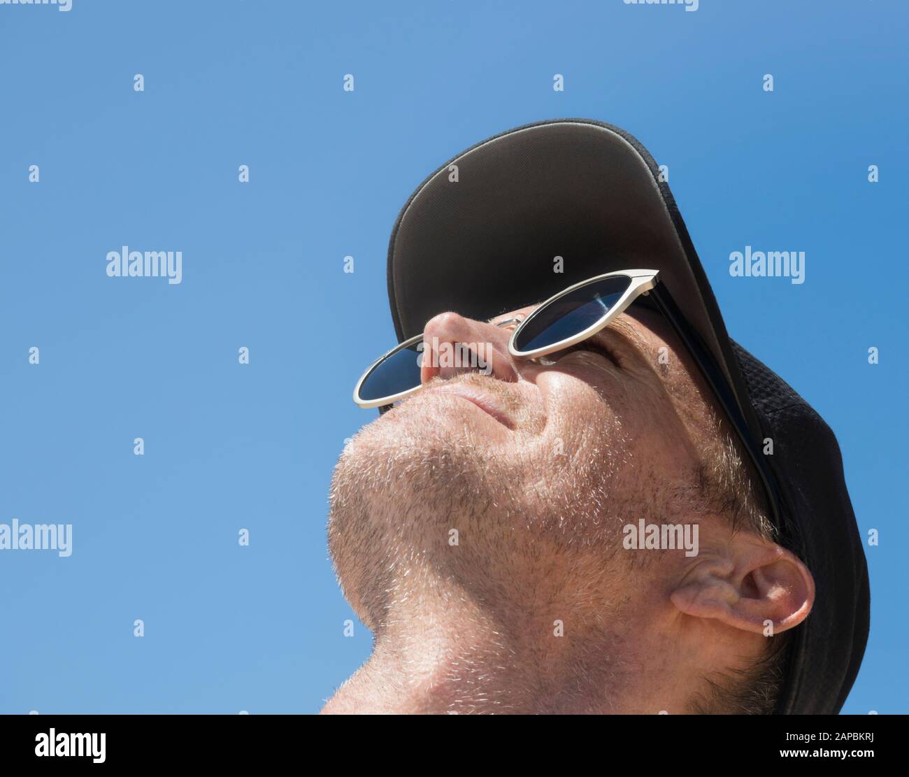 Man looking up to the sky. Stock Photo