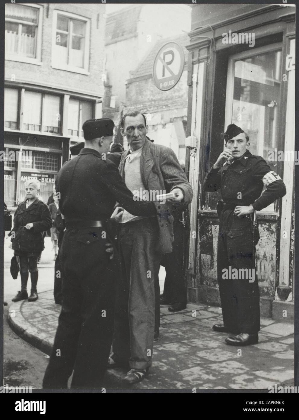 Misery civilian population Netherlands Description: Amsterdam. Fouiling for black trade Annotation: See 900-9712 Date: October 1945 Location: Netherlands Keywords: war, wars Stock Photo