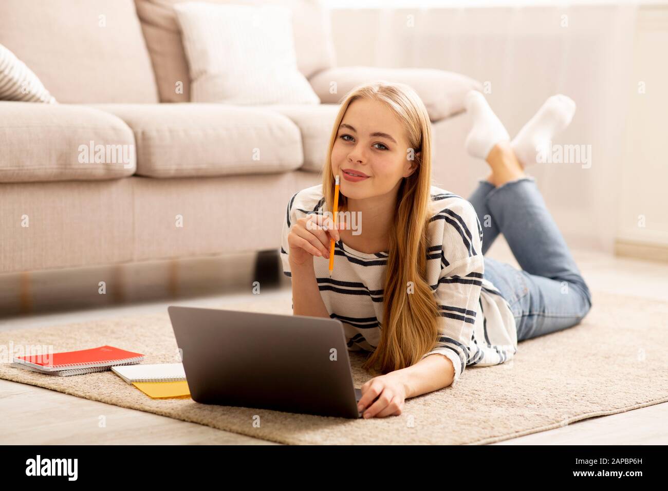 Pretty Girl Studying at Home, Using Laptop Stock Photo - Alamy