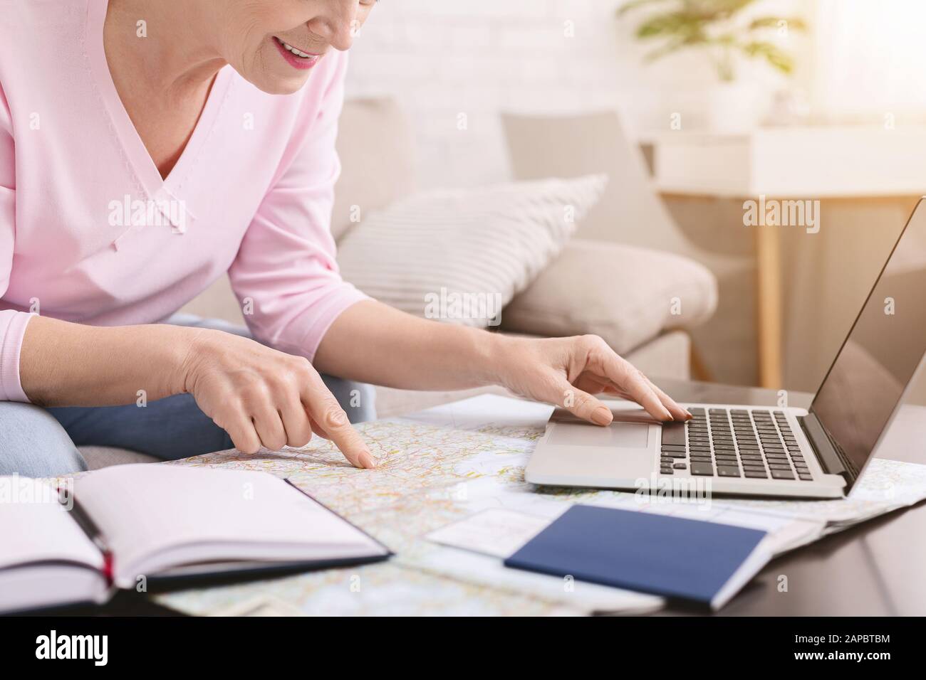 Planning vacation laptop map hi-res stock photography and images - Alamy