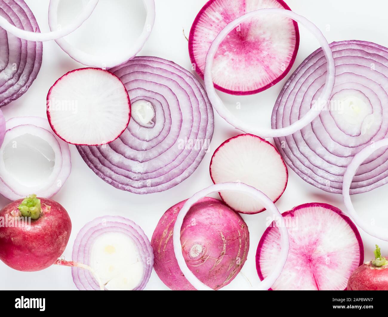 A macro view of an arrangement of overlapping red onion rings and