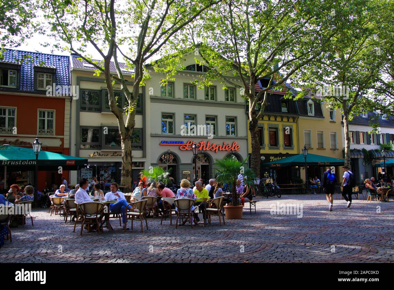 VIERSEN (KEMPEN), GERMANY - AUGUST 23. 2019: People sitting outdoor on market place under trees in summer Stock Photo