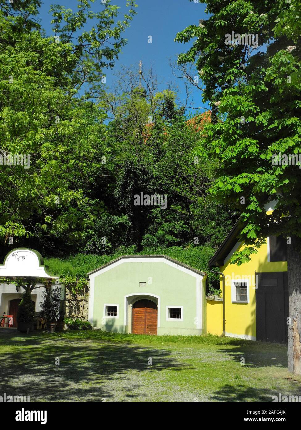 Austria, wine cellars and church, springtime in rural village Reisenberg in Lower Austria Stock Photo