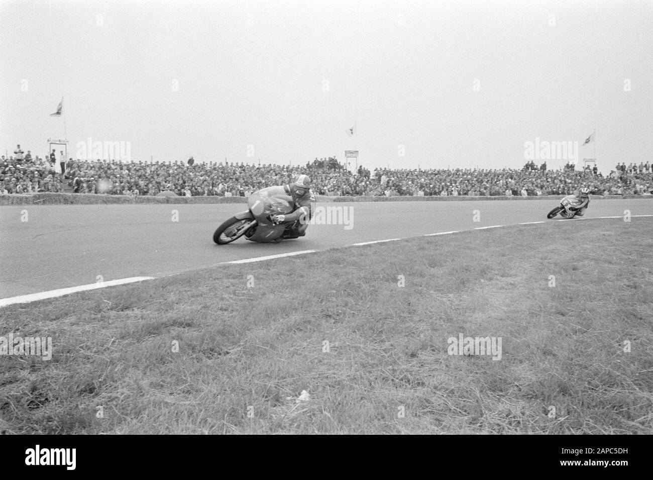 TT Assen 1971 Description: 350cc race. Giacomo Agostini (no. 1), behind ...