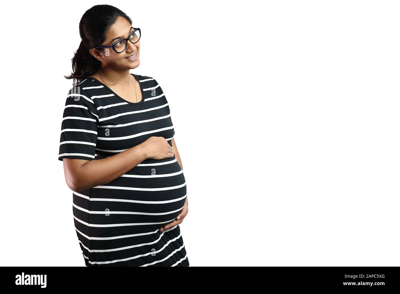 A pregnant lady wearing spectacles with 