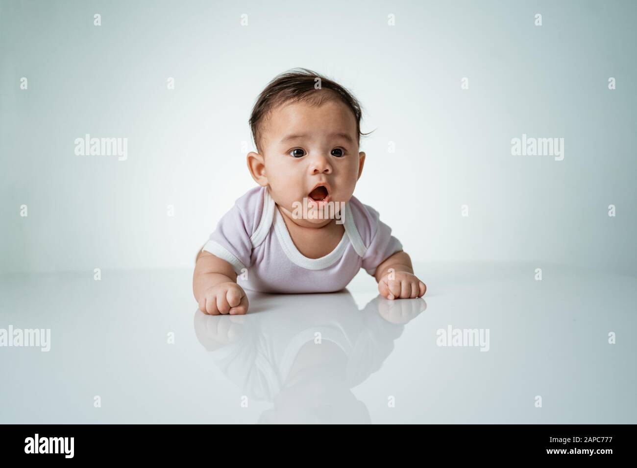 baby is on his stomach development Stock Photo - Alamy