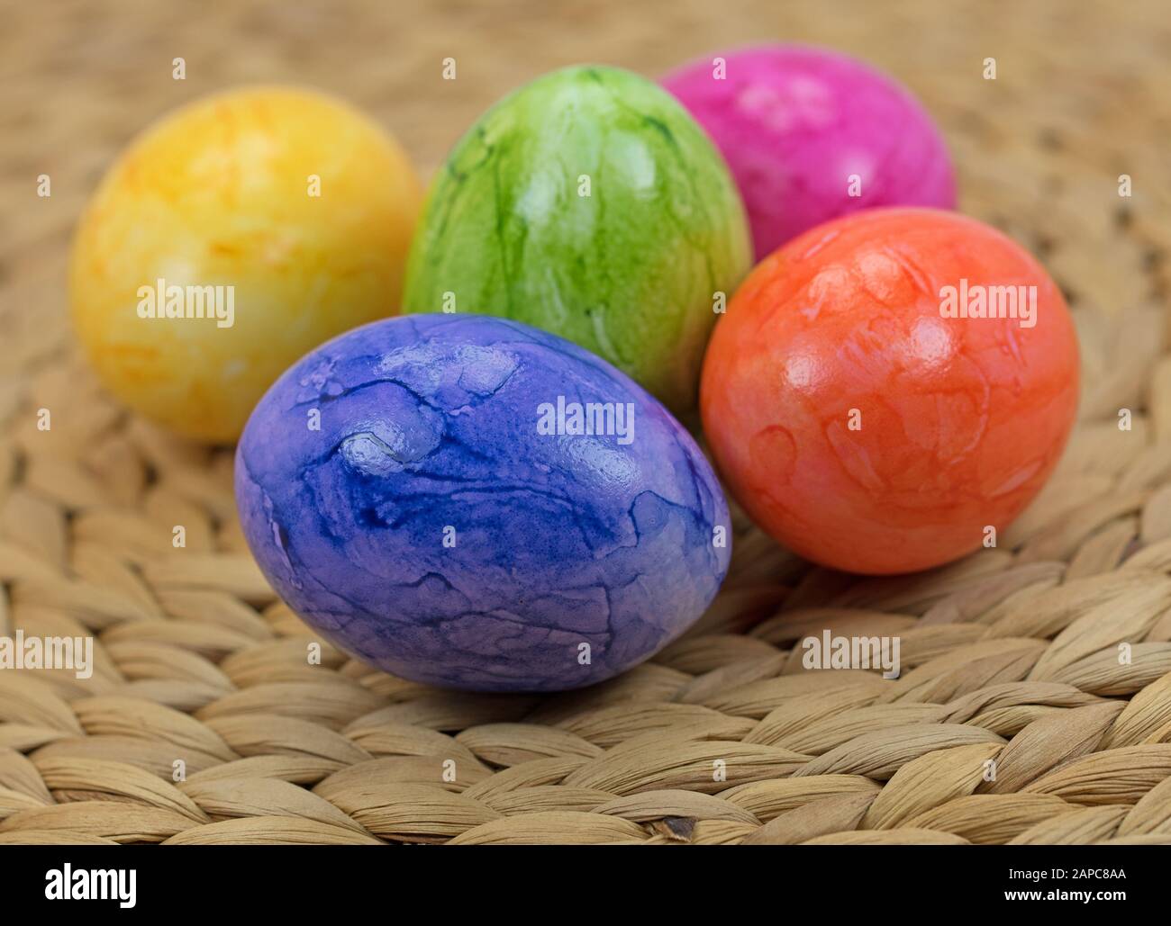Colorful easter eggs in basket Stock Photo