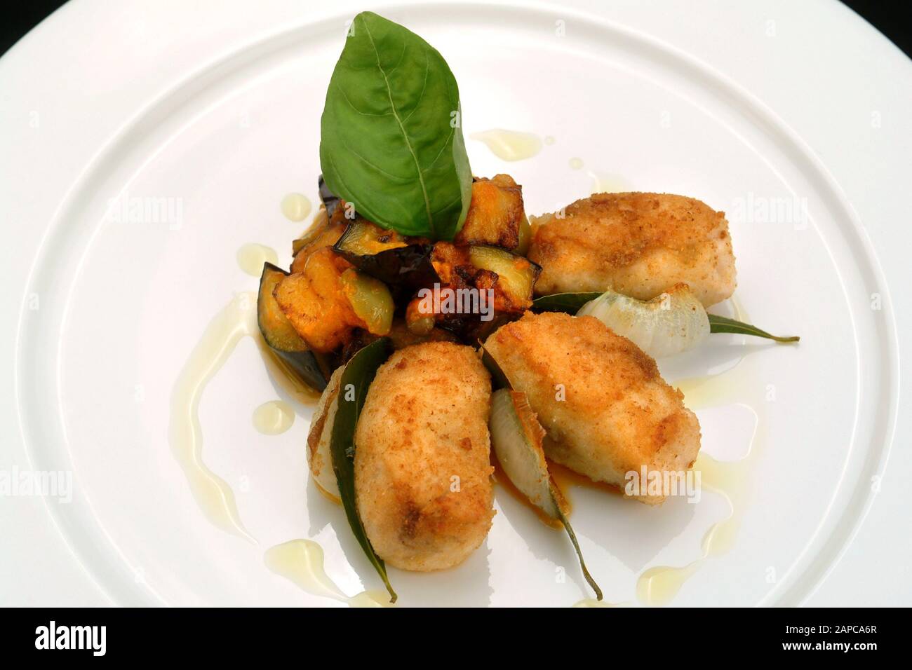 Italian food recipes, swordfish with vegetable caponata Stock Photo