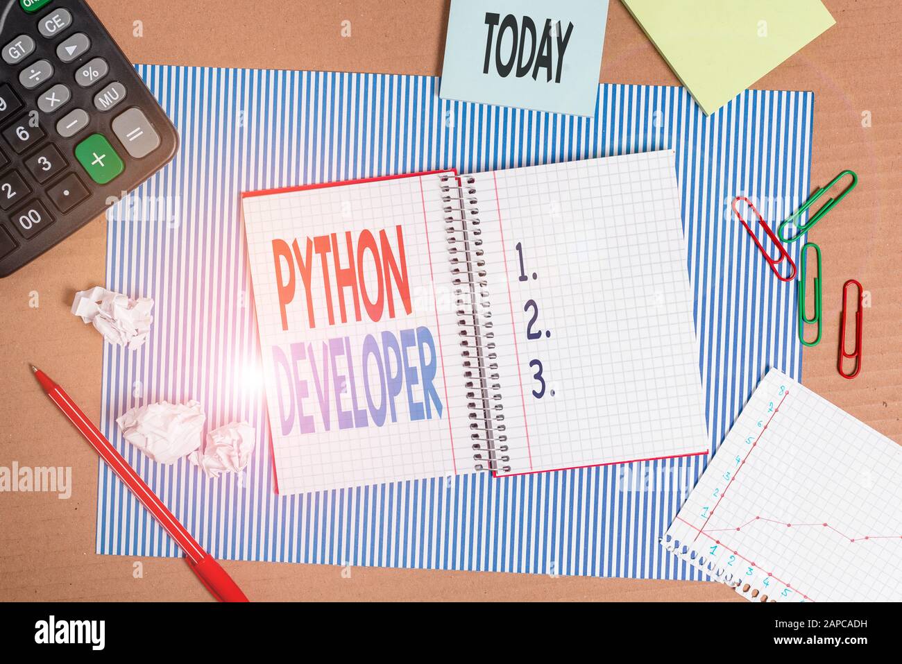Writing note showing Python Developer. Business concept for responsible for writing serverside web application logic Striped paperboard notebook cardb Stock Photo