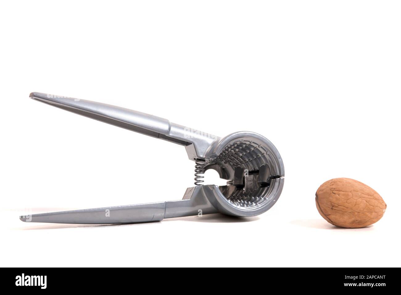 View of a metal tool for cracking nuts isolated on a white background