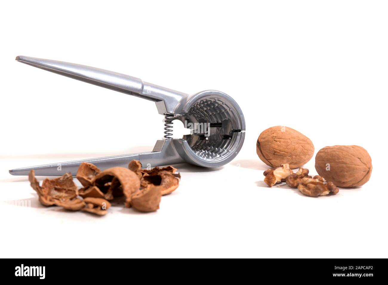 View of a metal tool for cracking nuts isolated on a white background