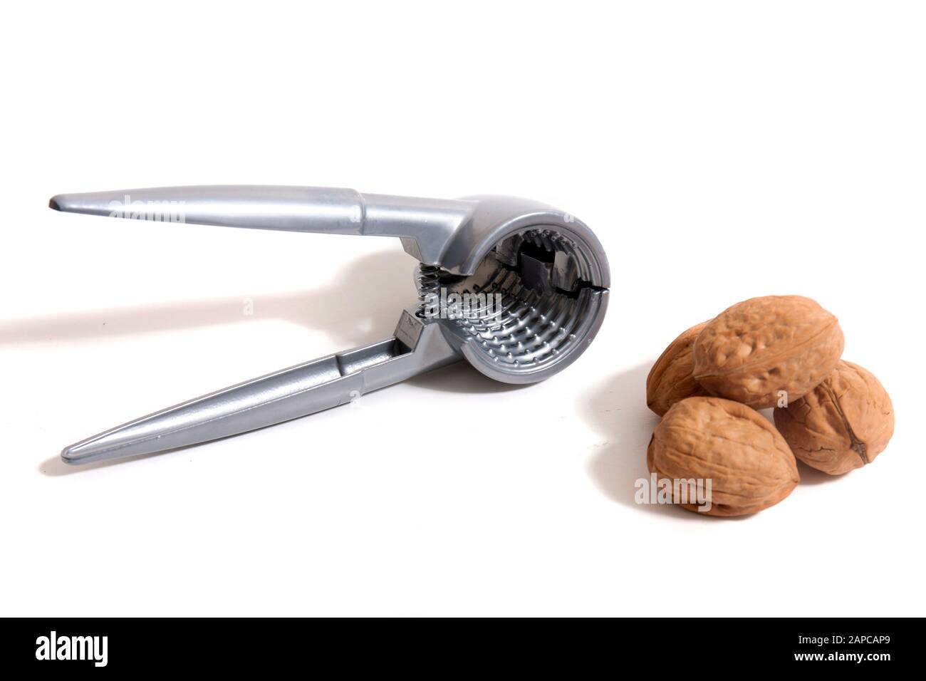 View of a metal tool for cracking nuts isolated on a white background