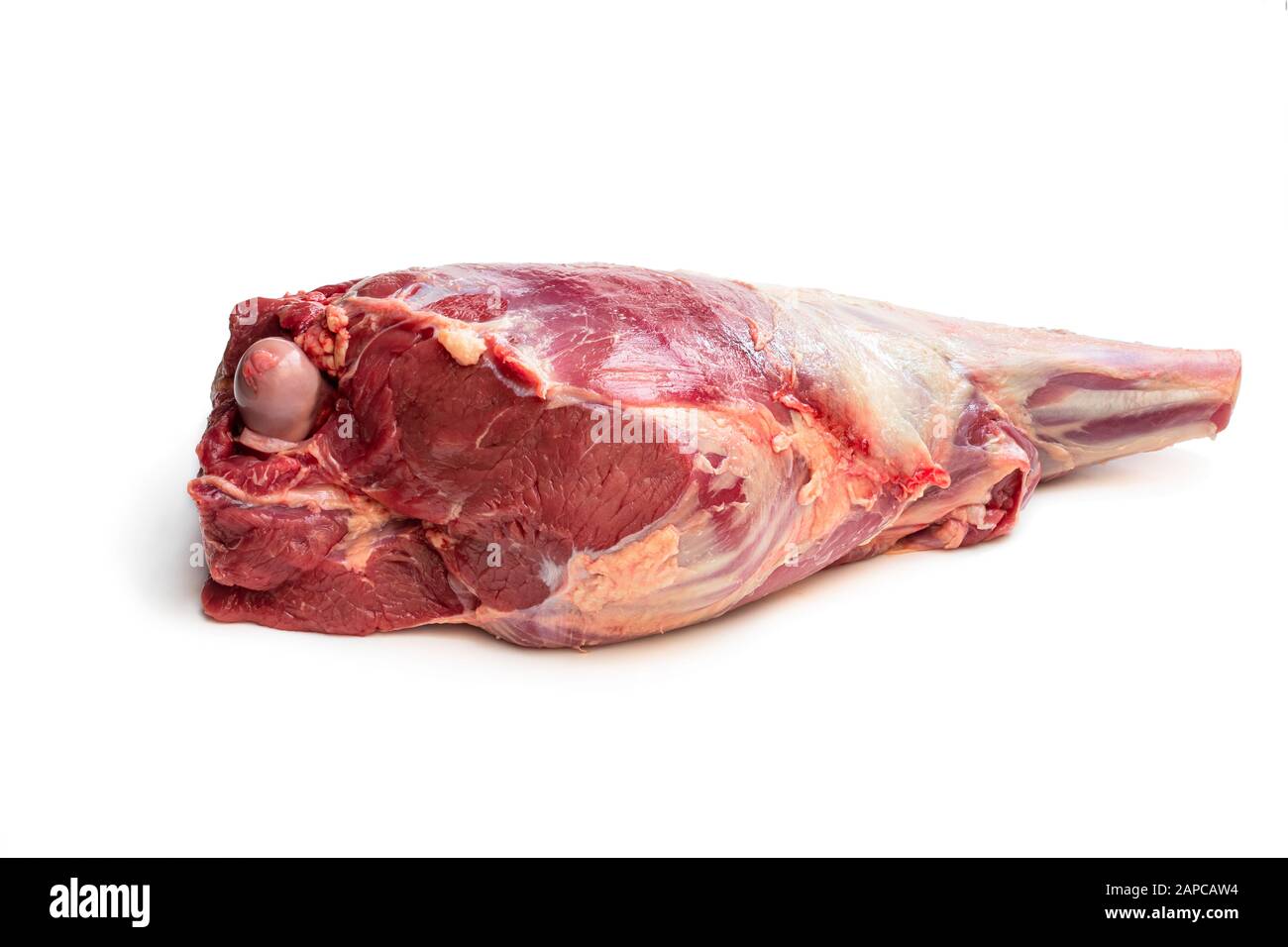 Fresh raw lamb leg isolated on white Stock Photo - Alamy