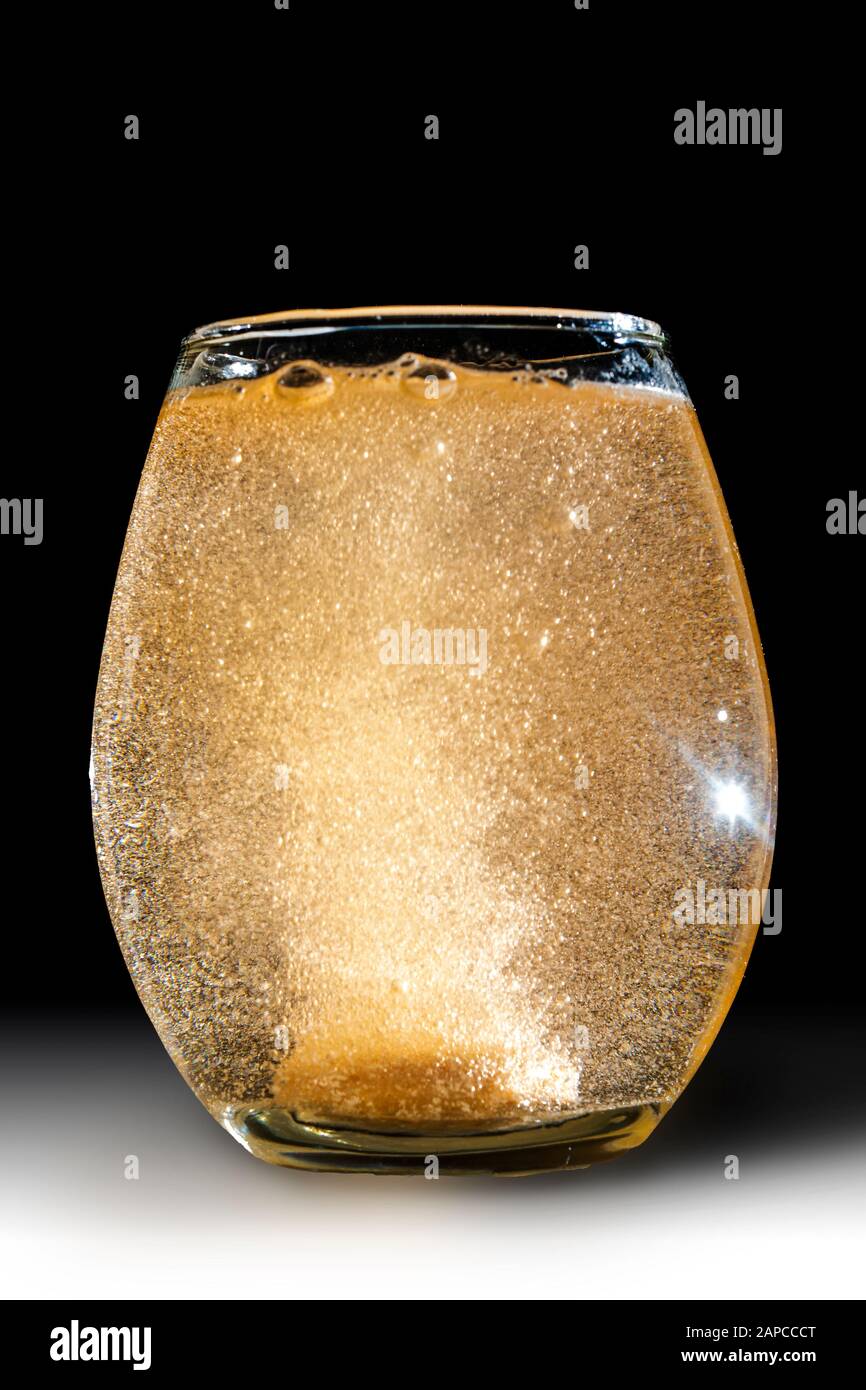 View of a effervescent Tablet dissolving in water Stock Photo - Alamy