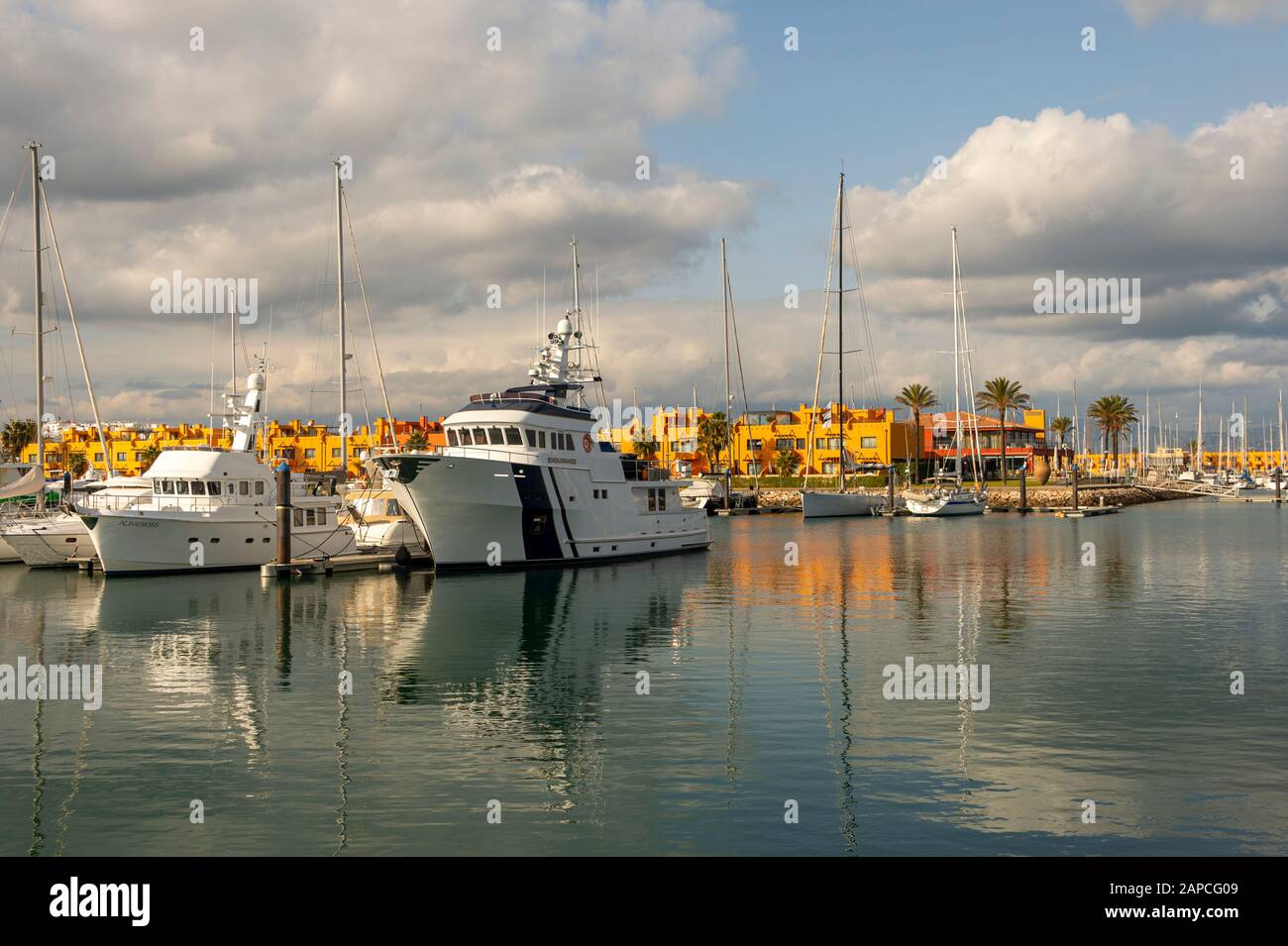 Luxury motor yachts moored in Portimao marina, Algarve, Portugal Stock Photo