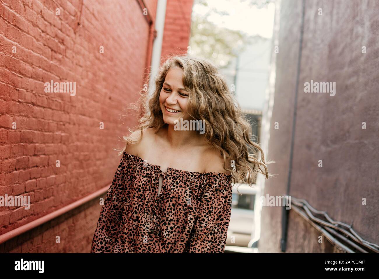 Happy girl in alley. Stock Photo