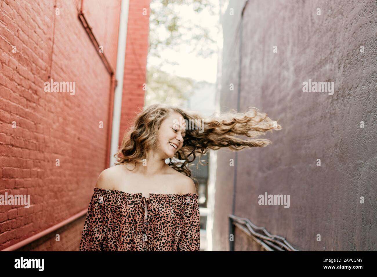 Happy girl in alley. Stock Photo
