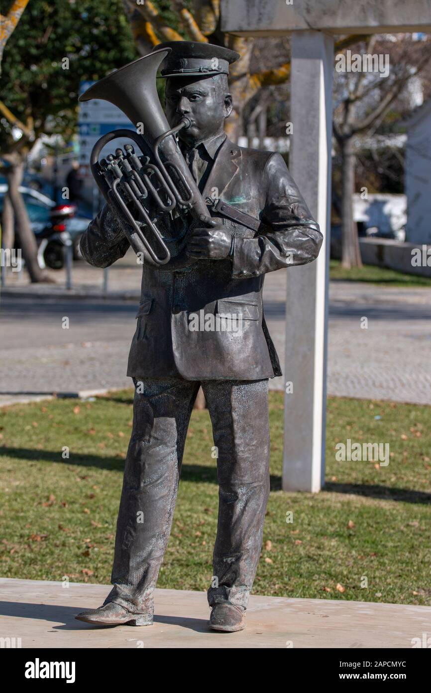 View of a statue of a musician tuba player located in Paderne, Portugal