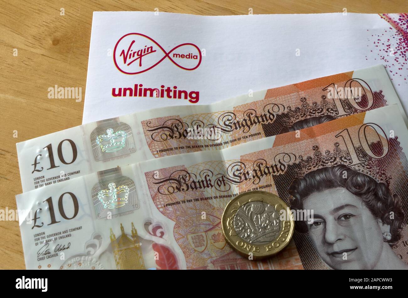 Virgin Media Unlimiting Broadband Logo and Cash, UK Stock Photo