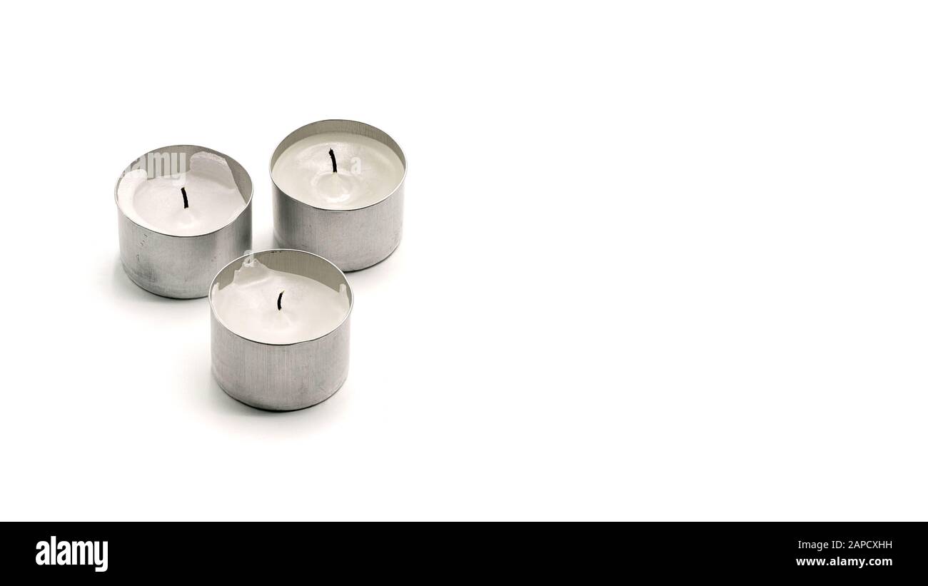 Three Used Small Candles, Isolated On White Background Stock Photo