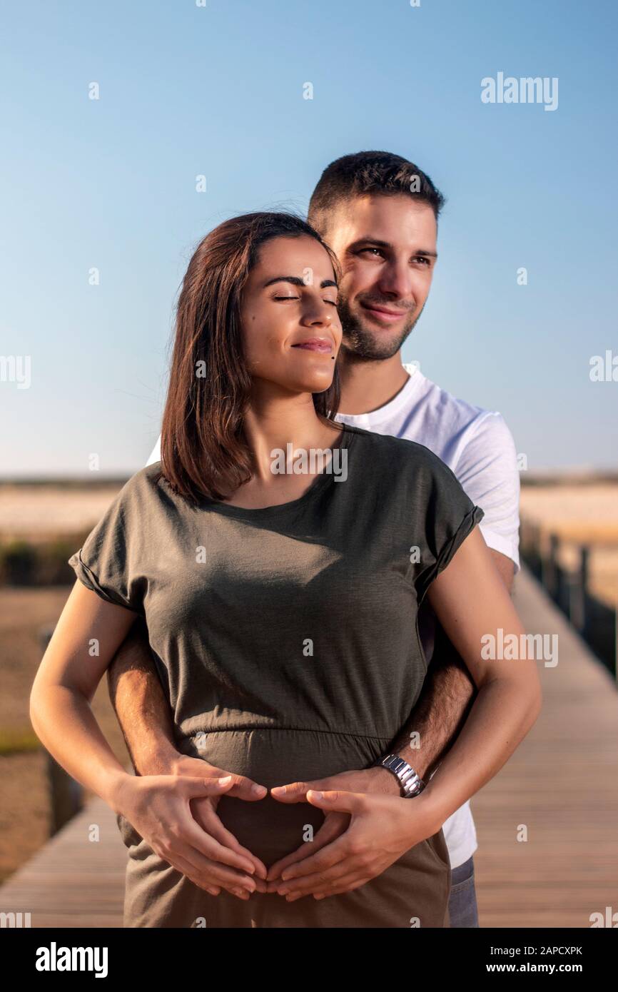 Image Of Happy Cute Young Loving Couple Posing Isolated Over Yellow  Background Hugging Showing Peace Gesture. Stock Photo, Picture and Royalty  Free Image. Image 110978960.