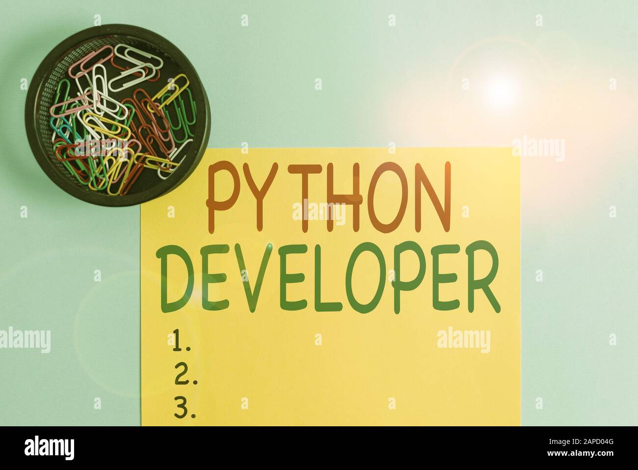 Handwriting text writing Python Developer. Conceptual photo responsible for writing serverside web application logic Plain cardboard and writing equip Stock Photo