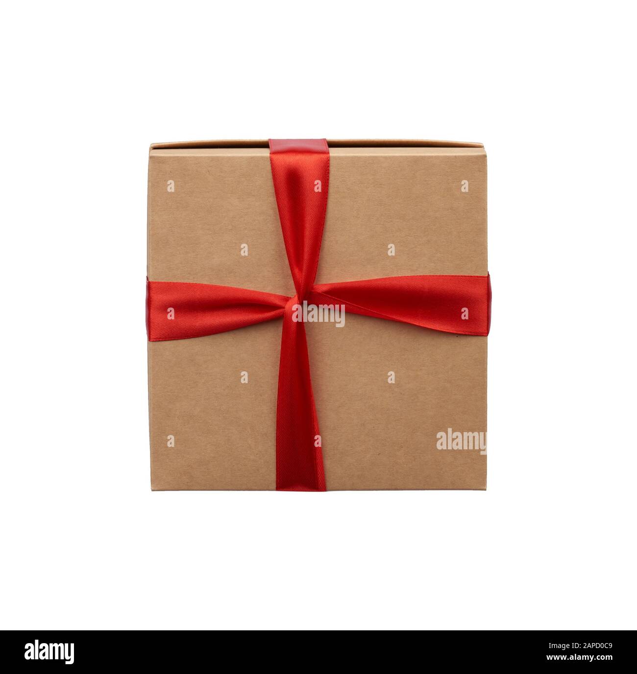 square box wrapped in brown kraft paper and tied with a silk red ribbon ...