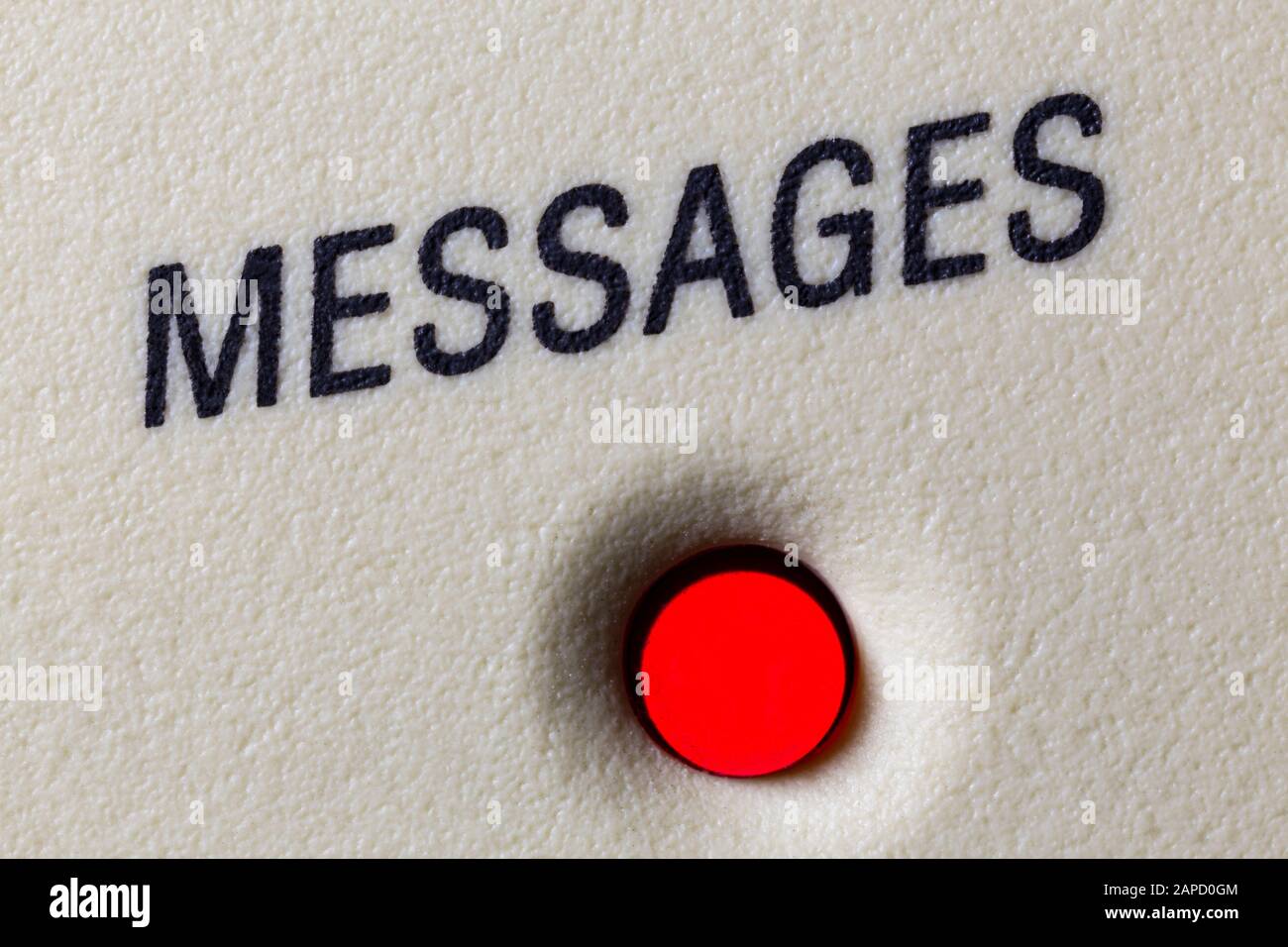 Macro close up photograph of messages light on vintage telephone answering machine. Stock Photo