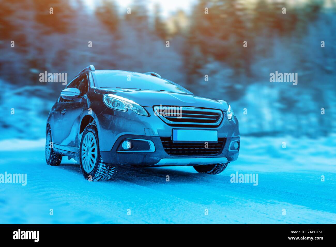 Modern suv car with four wheel drive on winter road. Concet of winter holidays and driving adventure Stock Photo