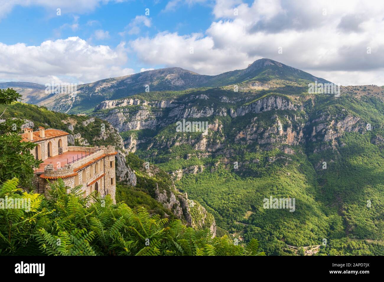 A medieval mountaintop castle overlooks a valley in the Alpes-Maritimes area of Southern France, near the village of Gourdon Stock Photo