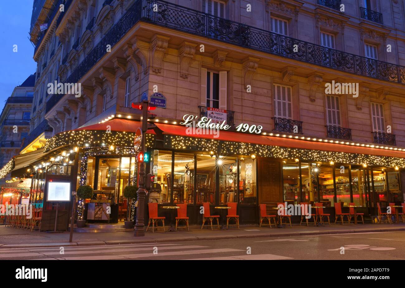 The traditional parisian restaurant Etoile 1903 at night . It located ...