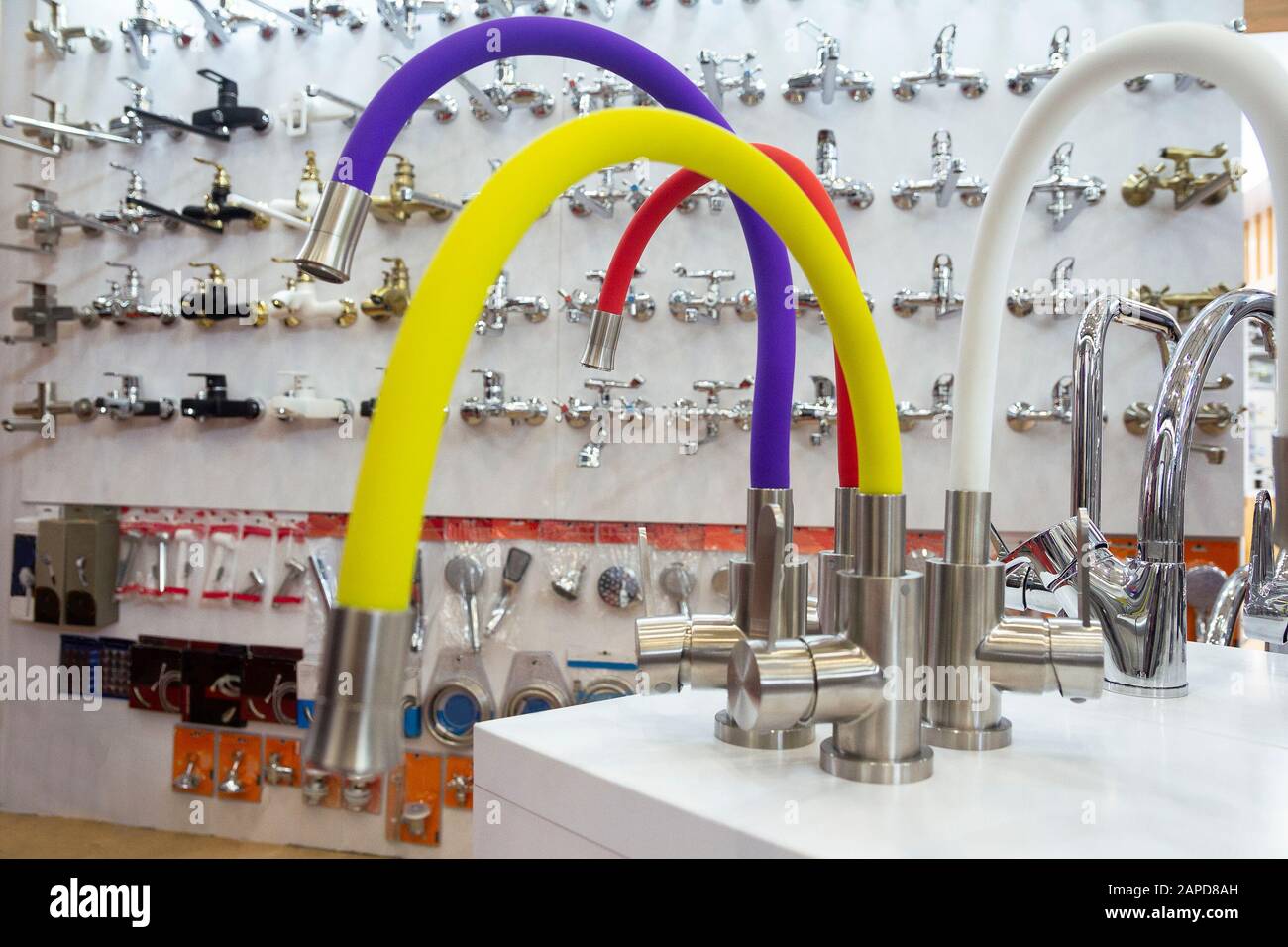 Rows of new faucets in plumbing shop, closeup Stock Photo Alamy