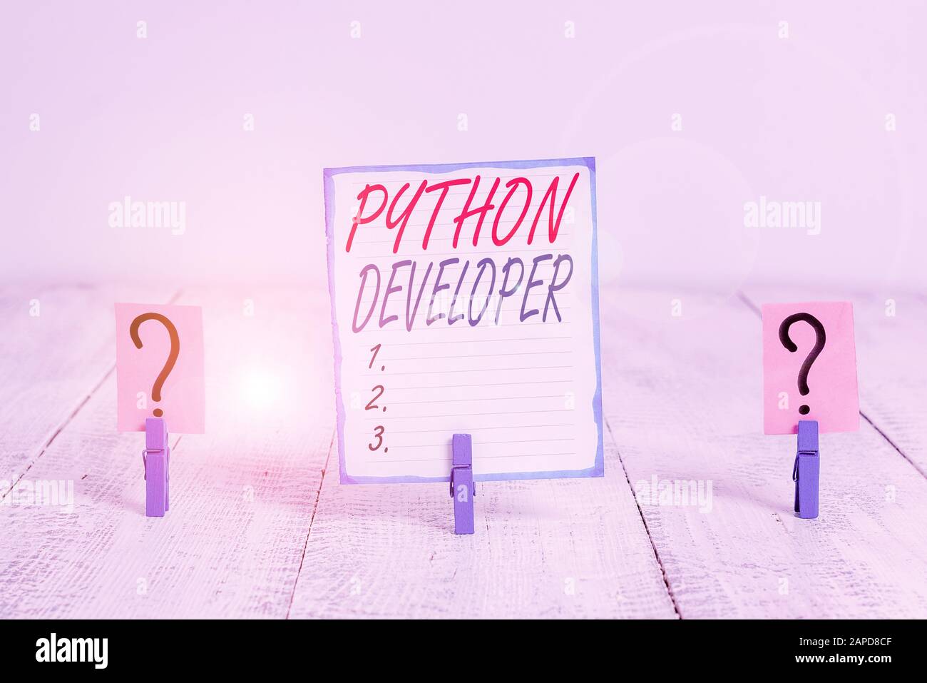 Writing note showing Python Developer. Business concept for responsible for writing serverside web application logic Crumbling sheet with paper clips Stock Photo