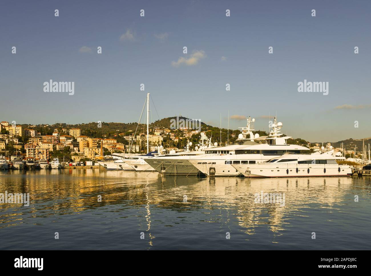 View of the tourist harbor of Porto Maurizio in the Riviera of Flowers with luxury yacht moored at pier in a sunny day, Imperia, Liguria, Italy Stock Photo