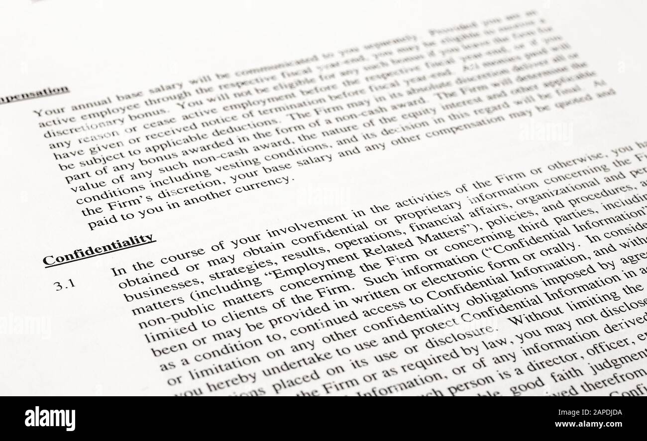 Text of Confidentiality clause of a generic corporate employment agreement. Shallow depth of field. Stock Photo