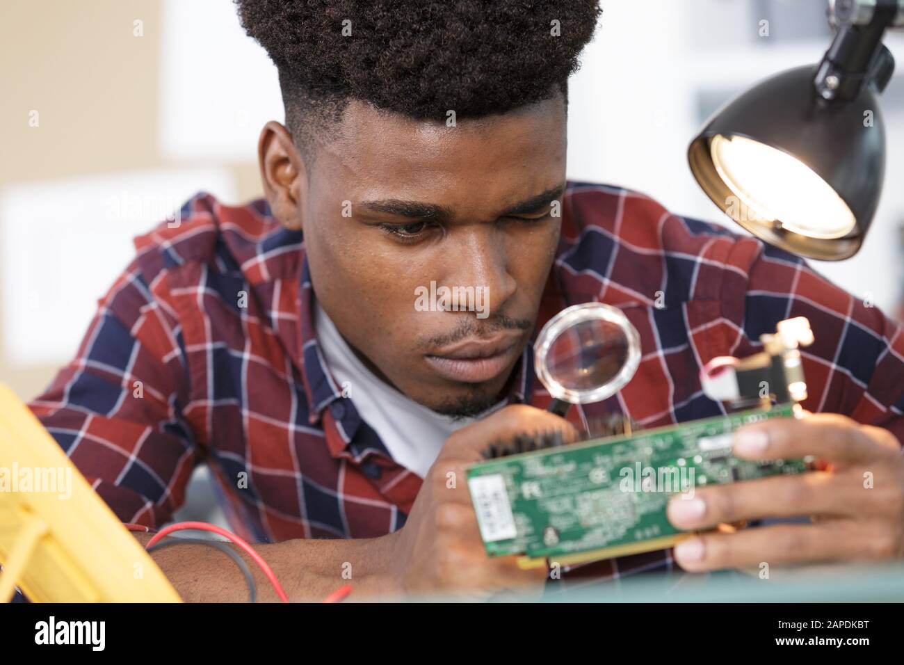 motherboard through a magnifying glass Stock Photo - Alamy