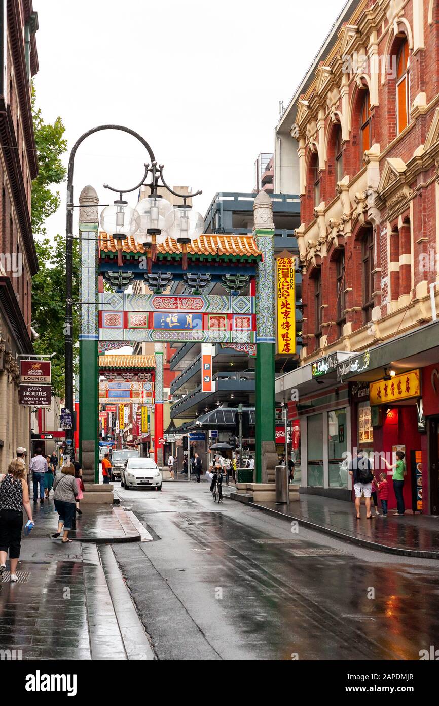 A decorative street lamp and oriental arch can be seen on Little Bourke Street, in Chinatown in Melbourne, Victoria, Australia. Stock Photo