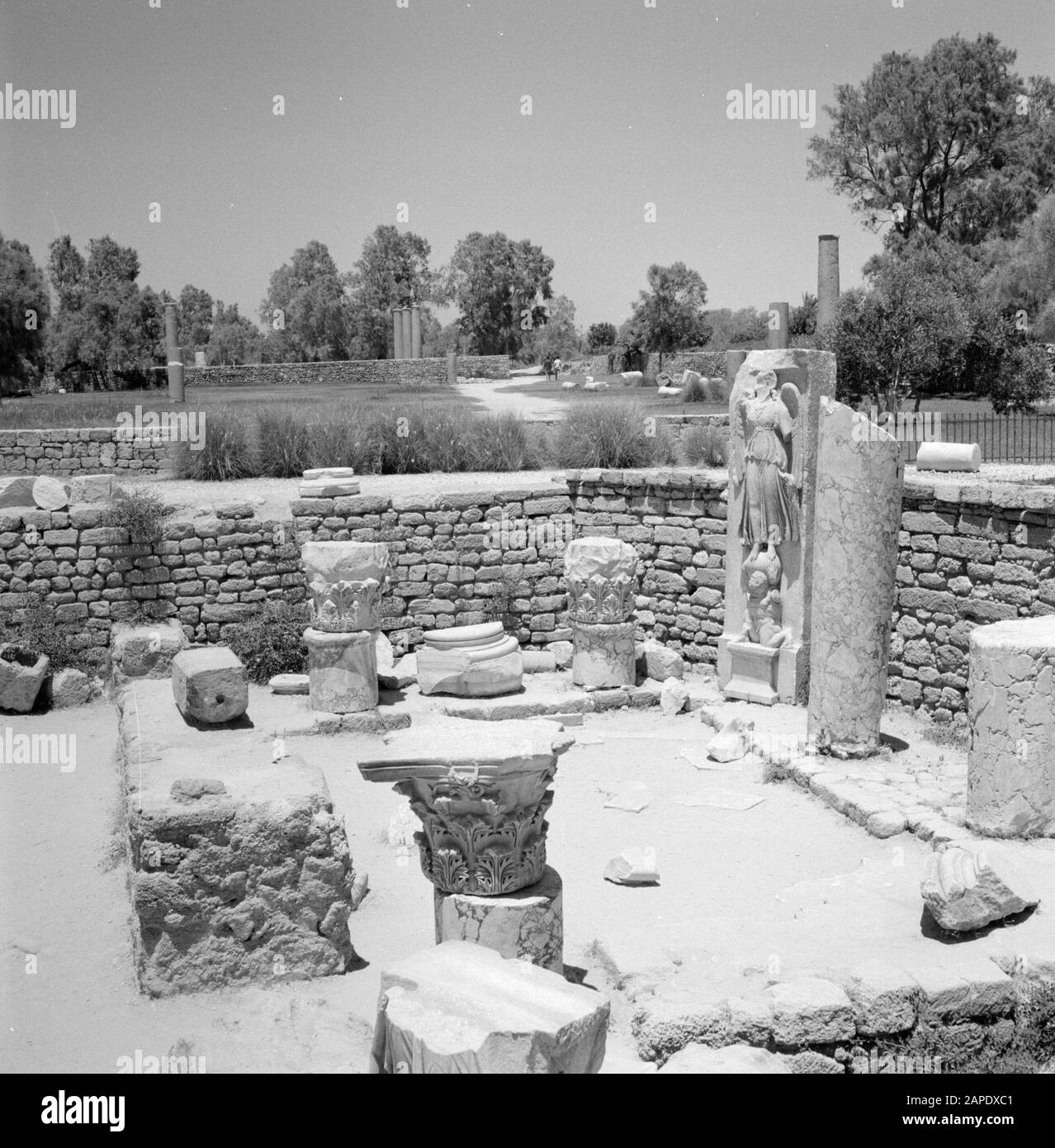 Israel 1964-1965: Ashkelon, archaeology Description: Archaeological site with building fragments including a statue of the goddess of victory Nike or Victoria Annotation: Ashkelon is a seaside resort in the southwest of Israel, located on the Mediterranean Date: 1964 Location: Ashkelon, Israel Keywords: archeology, sculptures, mythology, pillars, religious art, ruins Personal name: Nike, Victoria Stock Photo