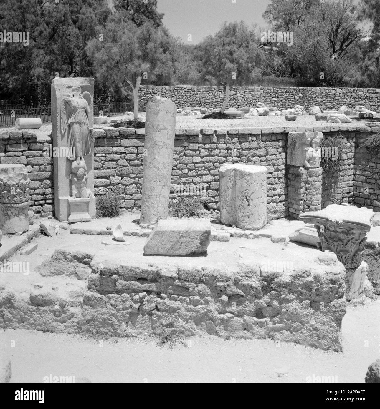 Israel 1964-1965: Ashkelon, archaeology Description: Archaeological site with building fragments including a statue of the goddess of victory Nike or Victoria Annotation: Ashkelon is a seaside resort in the southwest of Israel, located on the Mediterranean Date: 1964 Location: Ashkelon, Israel Keywords: archeology, sculptures, mythology, pillars, religious art, ruins Personal name: Nike, Victoria Stock Photo
