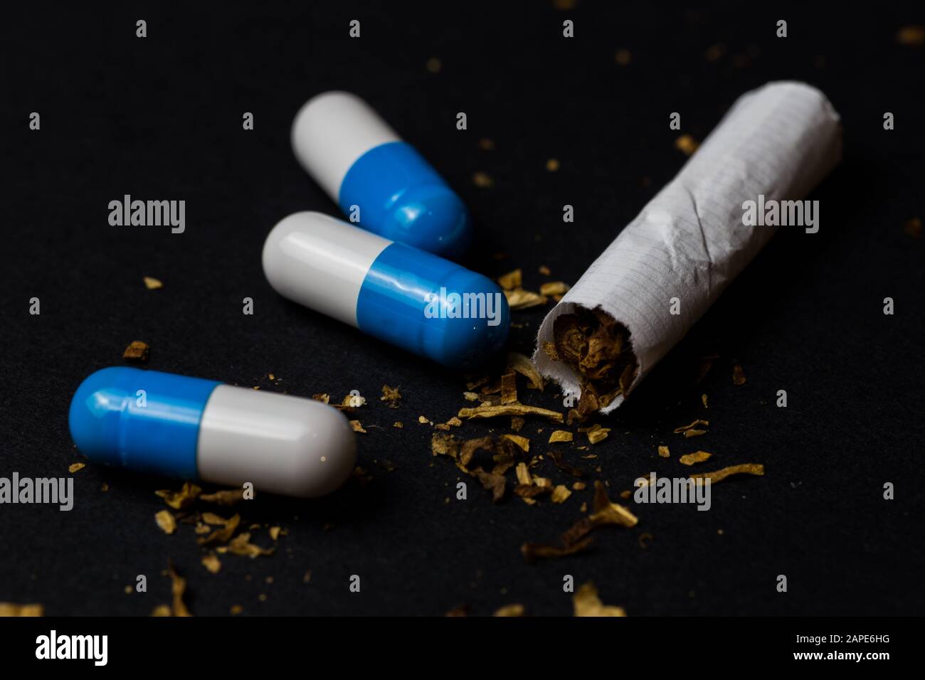 Closeup shot of a cigarette and medicine capsule - smoking is dangerous  concept Stock Photo