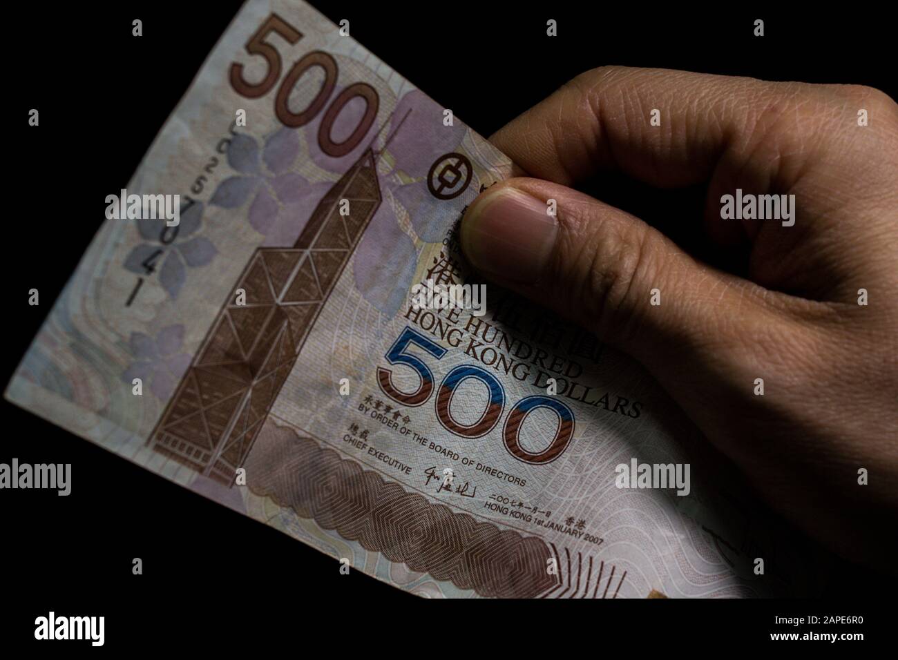 Closeup shot of 500 Hong Kong dollars (HKD) banknotes in front of a black background Stock Photo