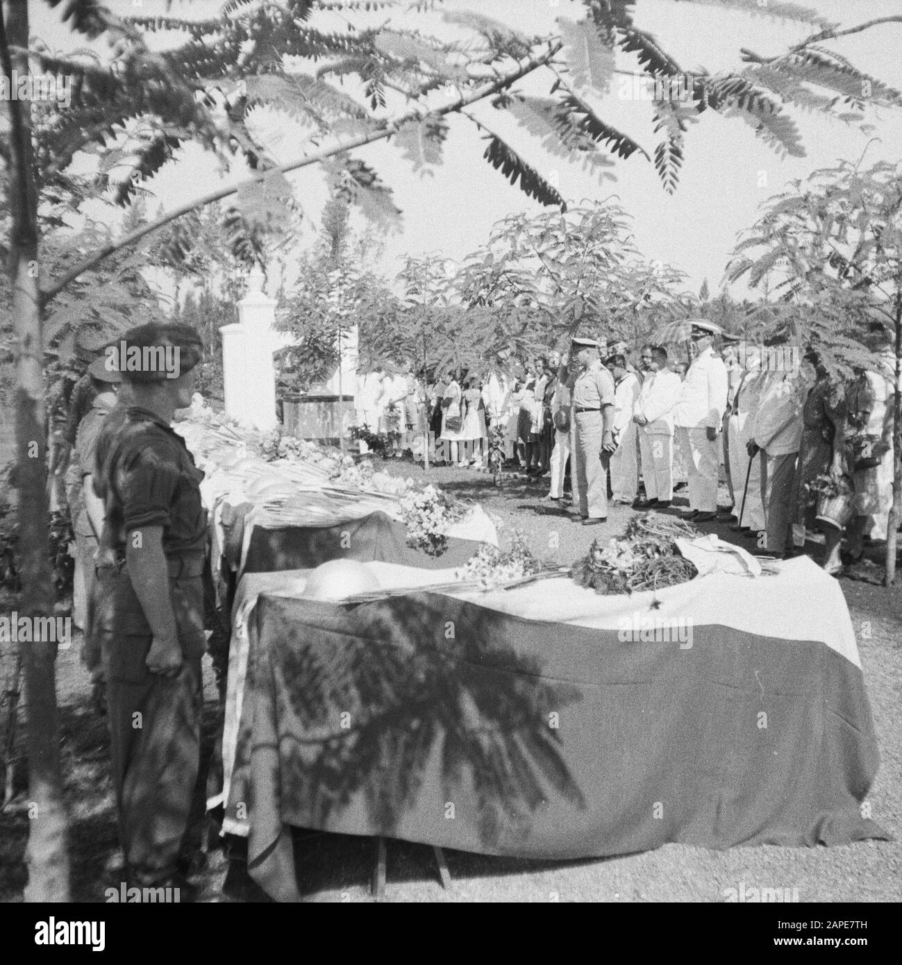 Re-burial of war victims at the Menteng Poeloeh honorary cemetery in Batavia Description: Batavia: On April 5th, a massive reburial of war victims took place on The Field of Honor Menteng Puluh. Annotation: Reburial of 21 war victims killed in Japan: A. van Barthold; A. A. Doonen; J. v. Eggelen; F. Goosens; M. Th. de Korte; Th. W. v. Loo; P. Lauterbach; P. de Maker, E. L. v. Menxel; H. C. v. d. Maal; J. Romeijn; M. Ruru; F. C. Steinmetz; J. T. Segers; J.L.H. v. Spek; R.H. Teuscher; F. Tangkilisan; w. Verhoeven; A. Iron. Date: 5 April 1948 Location: Batavia, Indonesia, Jakarta, Dutch East Indie Stock Photo