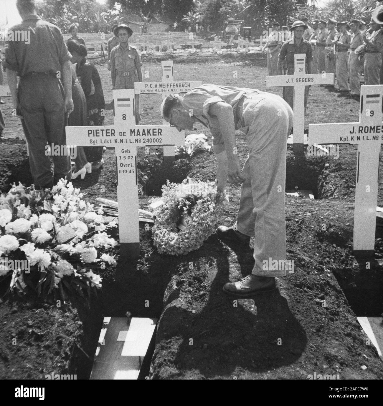 Re-burial of war victims at the Menteng Poeloeh honorary cemetery in Batavia Description: Batavia: On April 5th, a massive reburial of war victims took place on The Field of Honor Menteng Puluh. Annotation: Reburial of 21 war victims killed in Japan: A. van Barthold; A. A. Doonen; J. v. Eggelen; F. Goosens; M. Th. de Korte; Th. W. v. Loo; P. Lauterbach; P. de Maker, E. L. v. Menxel; H. C. v. d. Maal; J. Romeijn; M. Ruru; F. C. Steinmetz; J. T. Segers; J.L.H. v. Spek; R.H. Teuscher; F. Tangkilisan; w. Verhoeven; A. Iron. Date: April 5, 1948 Location: Batavia, Indonesia, Jakarta, Dutch East Indi Stock Photo
