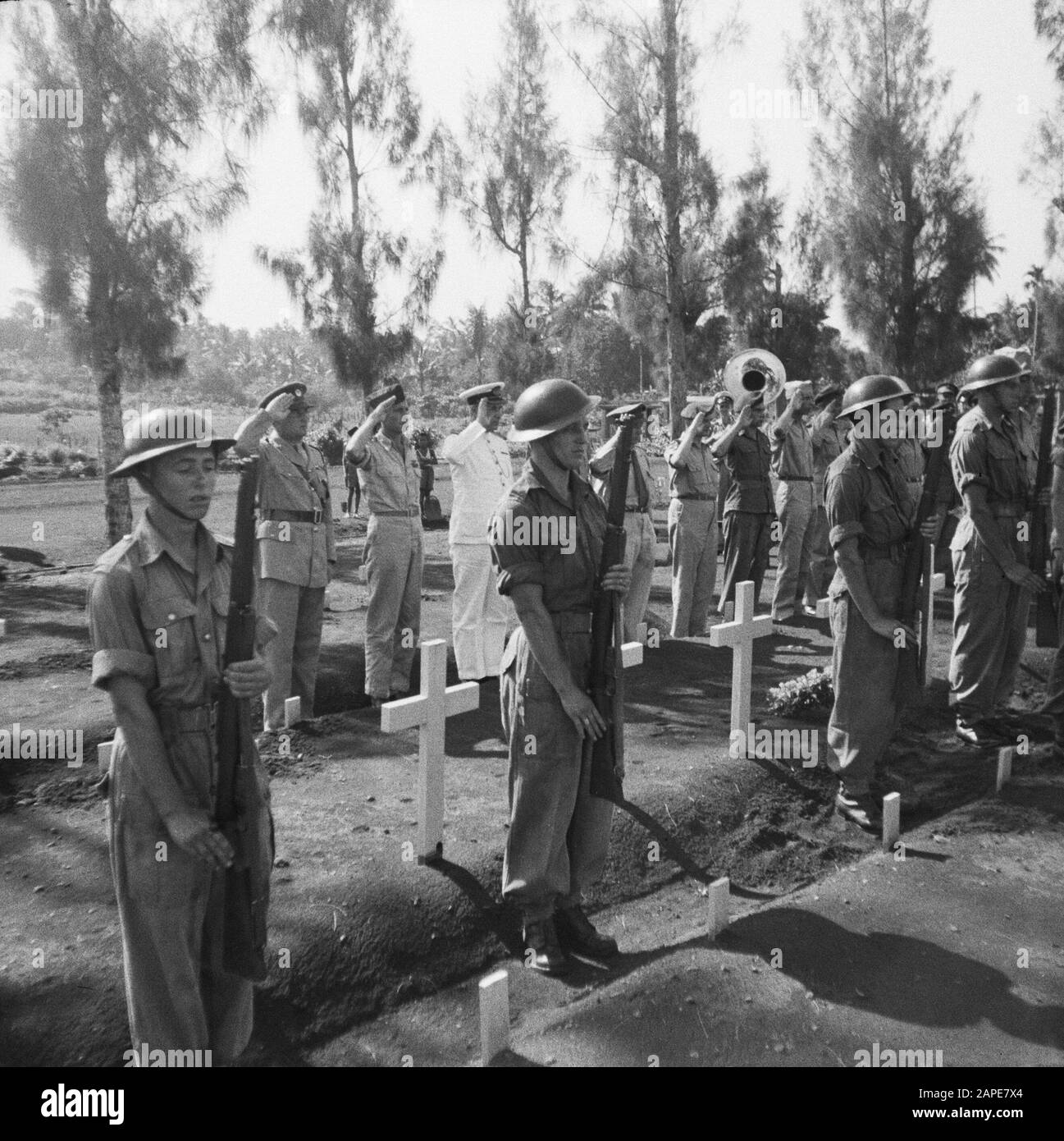 Re-burial of war victims at the Menteng Poeloeh honorary cemetery in Batavia Description: Batavia: On April 5th, a massive reburial of war victims took place on The Field of Honor Menteng Puluh. Annotation: Reburial of 21 war victims killed in Japan: A. van Barthold; A. A. Doonen; J. v. Eggelen; F. Goosens; M. Th. de Korte; Th. W. v. Loo; P. Lauterbach; P. de Maker, E. L. v. Menxel; H. C. v. d. Maal; J. Romeijn; M. Ruru; F. C. Steinmetz; J. T. Segers; J.L.H. v. Spek; R.H. Teuscher; F. Tangkilisan; w. Verhoeven; A. Iron. Date: 5 April 1948 Location: Batavia, Indonesia, Jakarta, Dutch East Indie Stock Photo