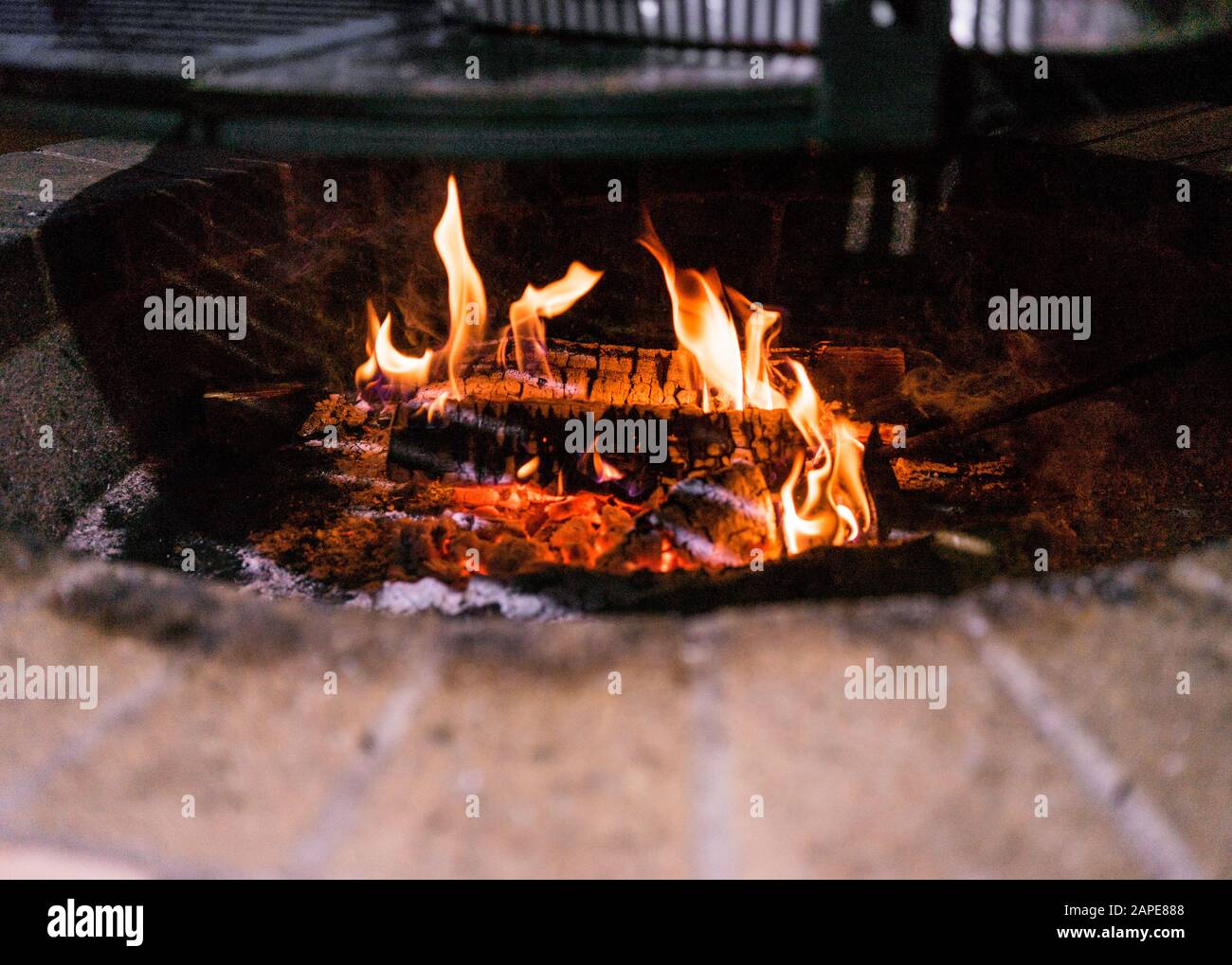Close up shot of a fire in a brick fire pit Stock Photo