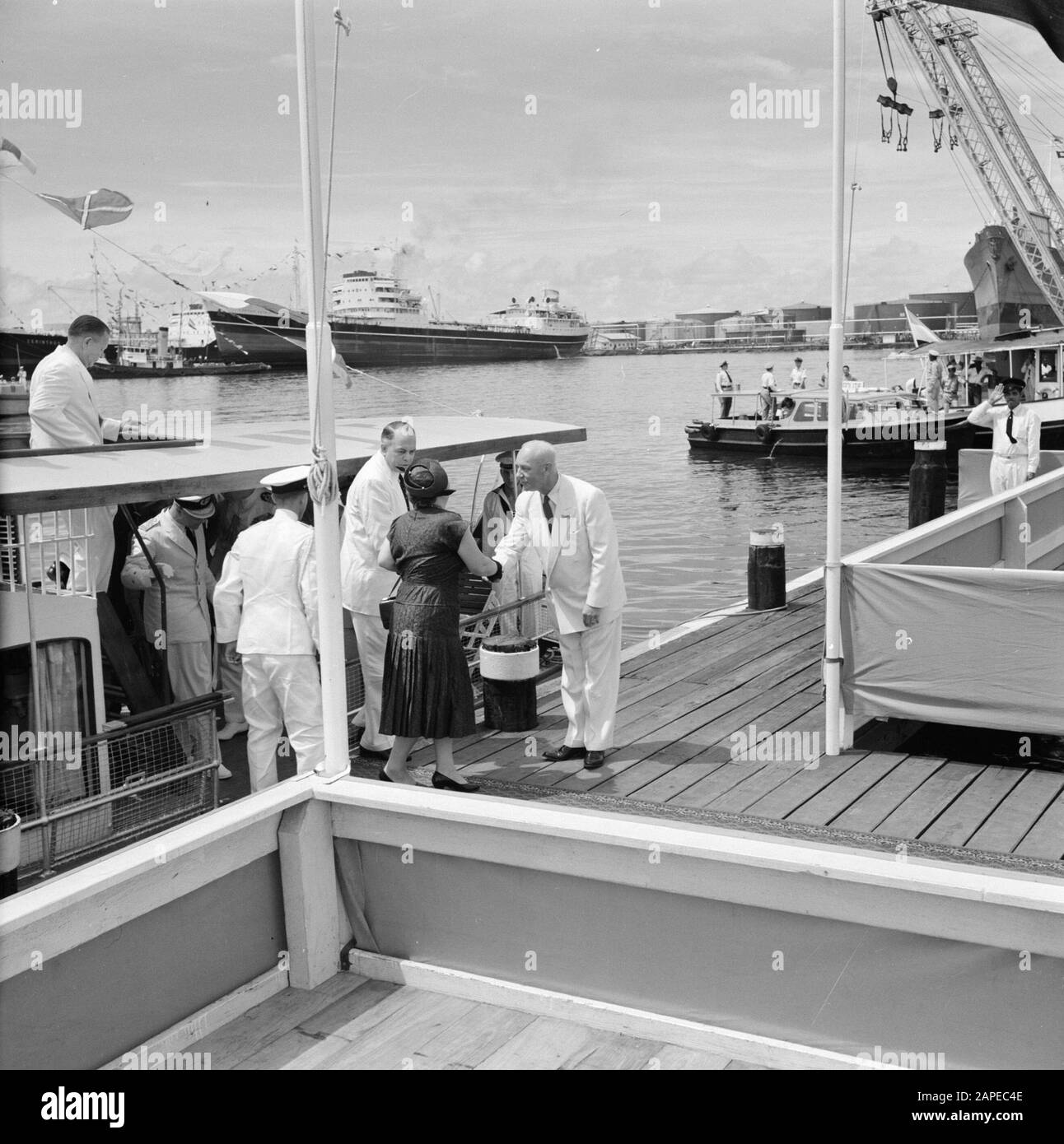 Netherlands Antilles and Suriname at the time of the royal visit of Queen Juliana and Prince Bernhard in 1955 Description: Greeting of Queen Juliana at the dock of the Isla refinery in Willemstad by Dr. Ir. H. ter Meulen Date: 21 October 1955 Location: Curaçao, Netherlands Antilles, Willemstad Keywords: royal visits, ships Personal name: Bernhard, prince, Juliana, queen, Meulen, H. ter Institution name: CPIM Stock Photo