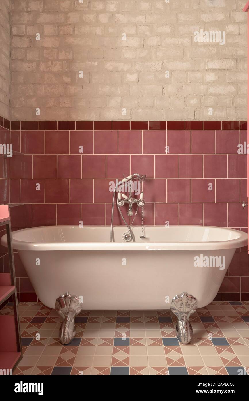 Empty acrylic bathtub with hand shower Stock Photo Alamy