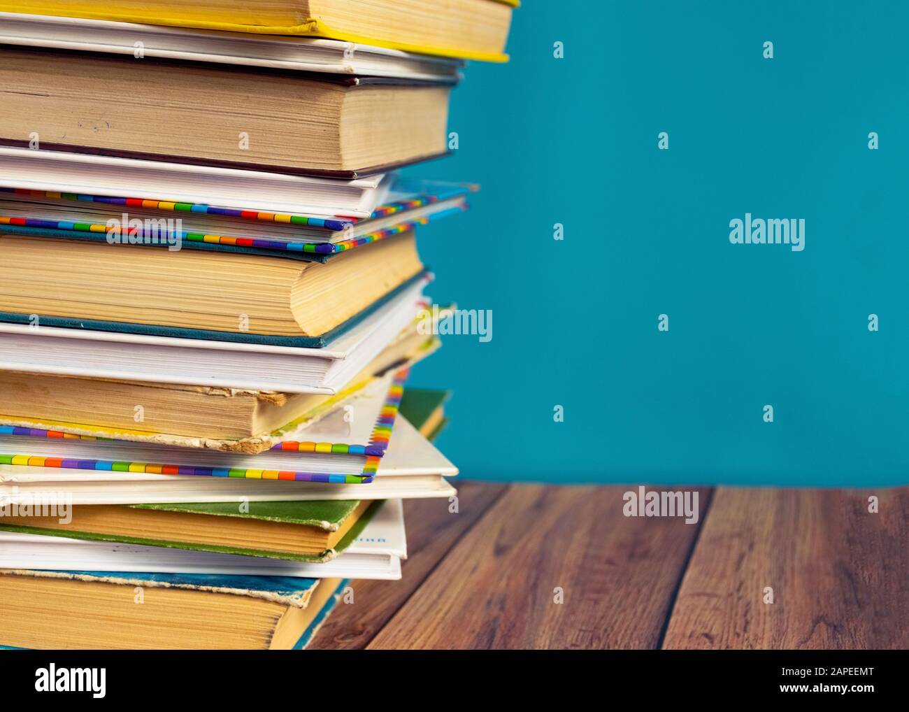 A stack of old books with yellow pages. Book binding. Knowledge and